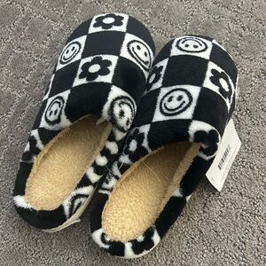 Black and white plush slippers. Ladies small (5-6)